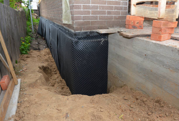 SJ Waterproofing Pros technician performing targeted Vapor Barrier Installation assessment in Orange, OH